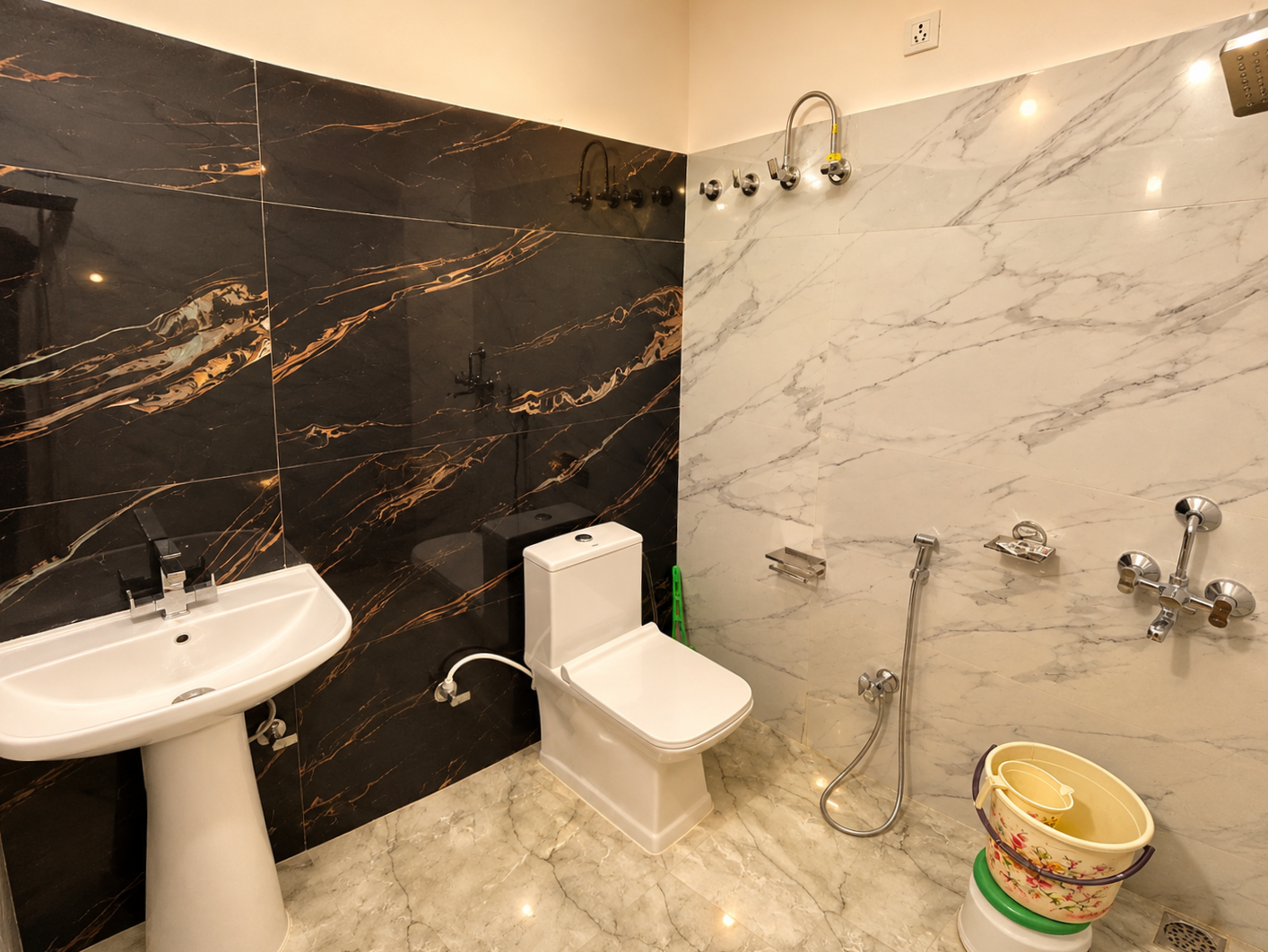 Clean guest bathroom with washbasin and shower